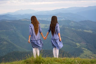 Two women looking over the mountains