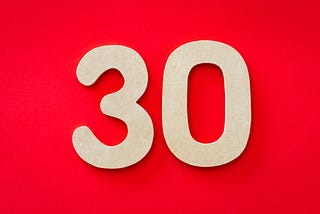 Image of the number “30” on a red background.