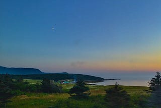 Sunset over cabins on the water in Rocky Harbour, Newfoundland and Labrador, Canada
