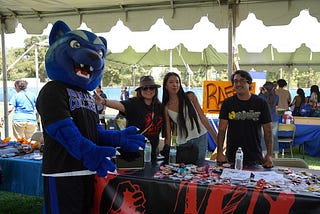Blu the Wolverine with students from a club