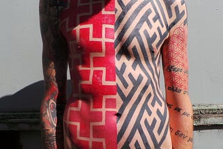 Why is this man covered in swastikas?