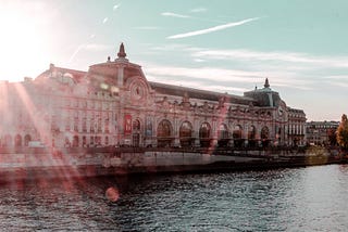 Building of the Orsay museum in Paris near the Seine during sunset.