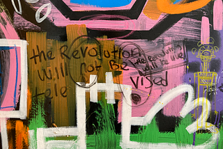 A brightly coloured artwork with the words ‘the revolution will not be televised, it will be live’ written on it