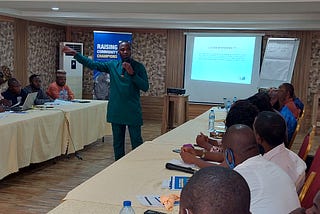 Cross section of Community Champions paying rapt attention to Iyanuoluwa Bolarinwa.