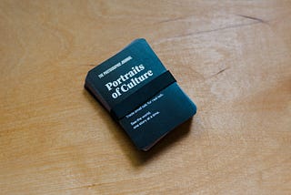 A stack of cards titled Portraits of Culture