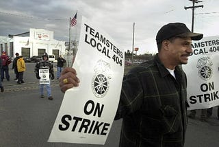 (Republican file photo) 04/01/02 Springfield Strike- Employees at the TiteFlex Company in Springfield show their on strike signs to management as they leave the building, Monday afternoon. The employees went on strike at 2 p.m. due to issues over salaries and seniority.