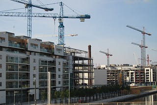 “Construction in Dublin Docklands” by Salim Virji is licensed under CC BY-SA 2.0