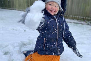 Author’s daughter throwing a snowball at the camera