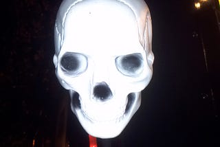 facing ourselves unmasked a skull lite in bright light