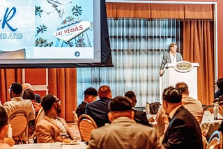 Zack Schuch leads business conference