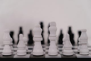 a black and white image of a unplayed chess board