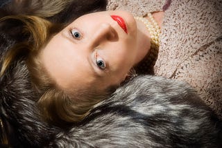 Portrait photograph of a woman in a style intended to convey glamour.