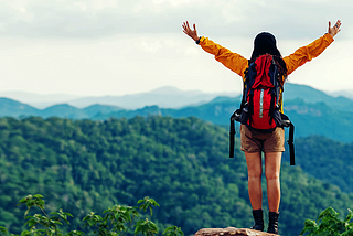 traveler with backpack adventure feeling victorious