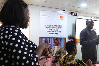 An interpreter and a facilitator addressing the class during a soft skill training