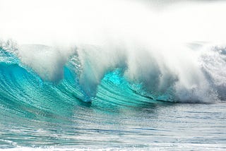 image of turquoise waves in the sea.