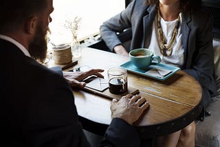 2 people connecting while drinking coffee