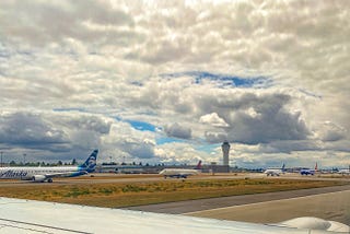 Planes lined up on the runway at Seattle-Tacoma Airport.