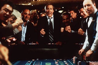 casino-goers yelling around a craps table