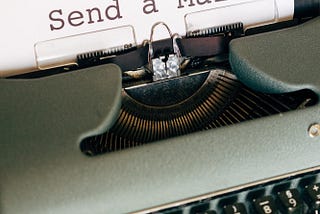 typewriter with type written sheet: ‘send a mail’