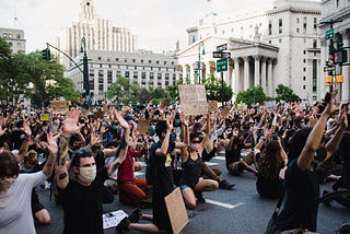 Crowd of people, predominantly White, participating in a Black Lives Matter Protest