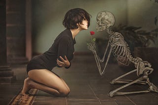 A woman kneeling on the floor, saying goodbye to a skeleton holding a red rose, which is the symbol of her lost love.