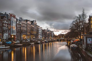 An illustration of Amsterdam canals at dawn