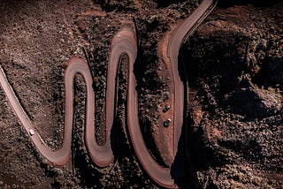 A winding road with three large switchbacks, representing three big changes