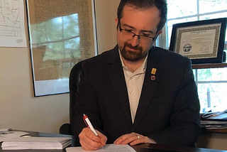 David Donofrio writing in an office