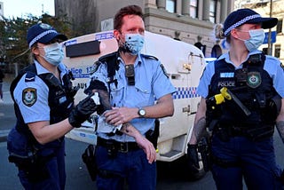 The unmasked participants marched from Sydney’s Victoria Park to Town Hall