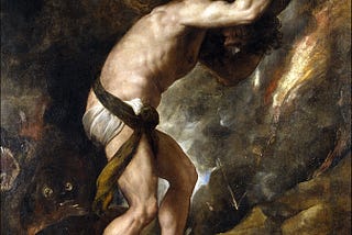 A man in a loin cloth carrying a large boulder atop his shoulders up a mountain side.