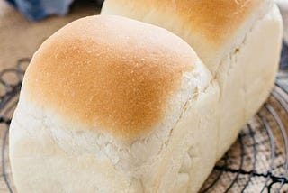 Loaf of fresh twin bread on a table