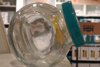 A glass container resting on its flat surface