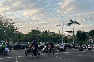 The first morning of my university orientation day; bicycles, motorcycles, and cars passed