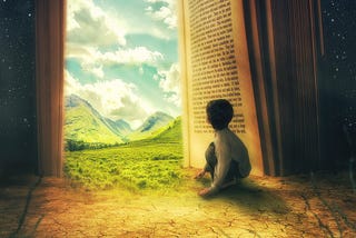 A small boy sitting on the hard-packed and cracked savannah plain, with the shadows of dry, dead trees behind him. In front of him is an open book, standing on its end and this book is acting as a doorway to another world. One of grassy terrain, tall mountains and a sunny, cloudy sky.