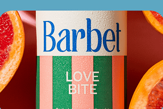 A colourful Barbet can surrounded by grapefruit slices