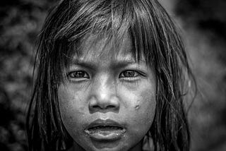 Black and white portrait of Nepalese child looking thoughtful