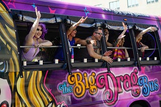 A group of drag queens and their allies ride in “the Big Drag Bus” during a Nashville Pride celebration.