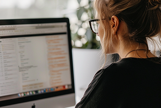 Woman looking at online job postings.