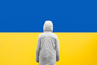 A person facing the Ukrainian flag