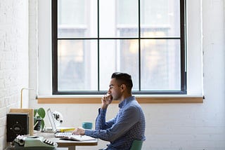 Man working from home in front of a laptop.