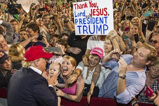 Christians hold sign for Donald, “Thanl you Lord Jesus for President Trump”