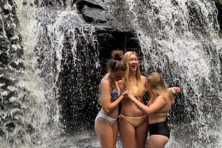 Three 17-year-olds hold each other up on the slippery rocks of Garwin Falls in Wilton, NH.