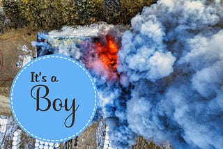 Explosion with blue smoke and graphic that says, “It’s a boy”