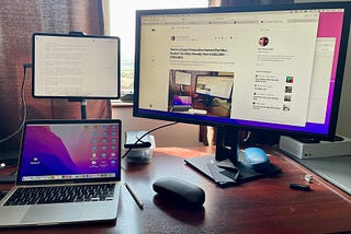 A photograph of my iPad Pro 12.9", Mac, and external monitor sitting on my desk.