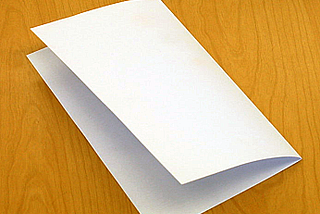 A blank sheet of paper folded in half