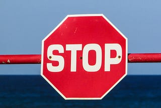 A stop sign bolted to a horizontal crossbar