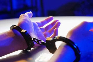 two hands handcuffed, as they may be to enrol in kink play