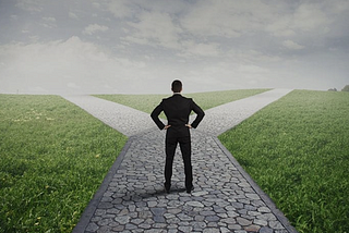 man at the crossroads making decisions