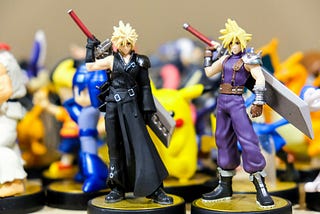 A photo focusing on two Cloud Strife from Final Fantasy VII action figures.