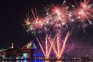 Fireworks explode over the Baltimore harbor.